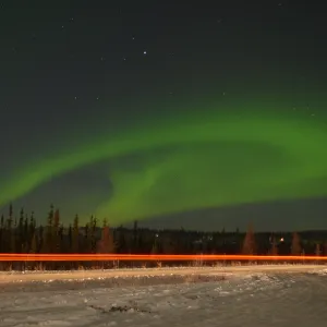 Zipping by the Aurora Sky