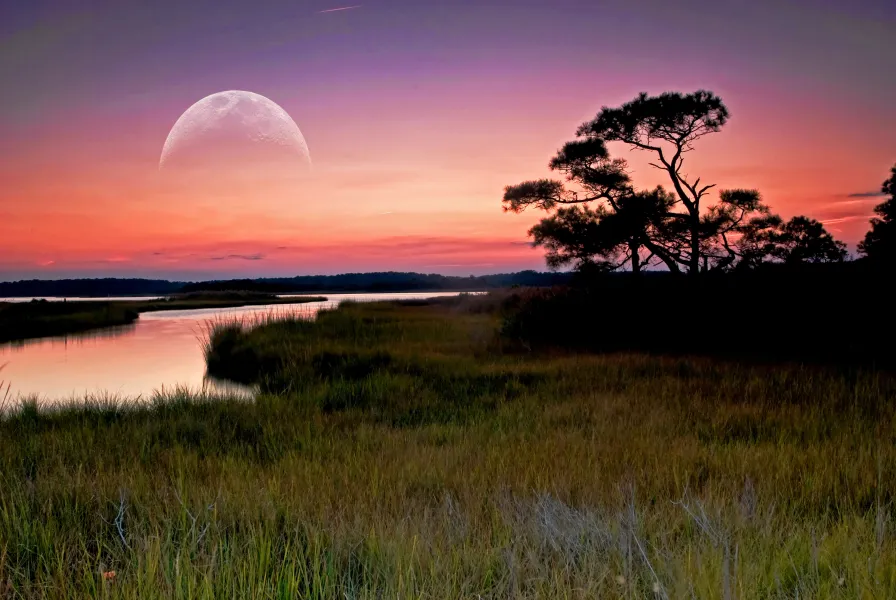 Sunset over Assawoman Bay as the moon rises.