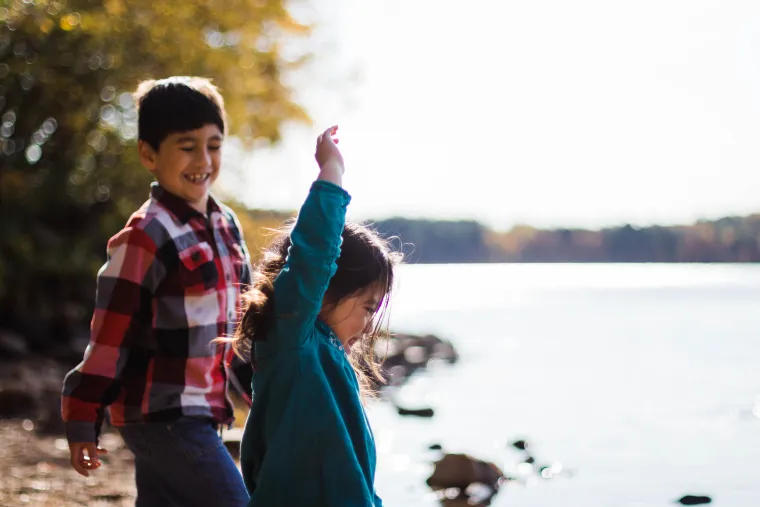 Learning to skip rocks is a team effort. 